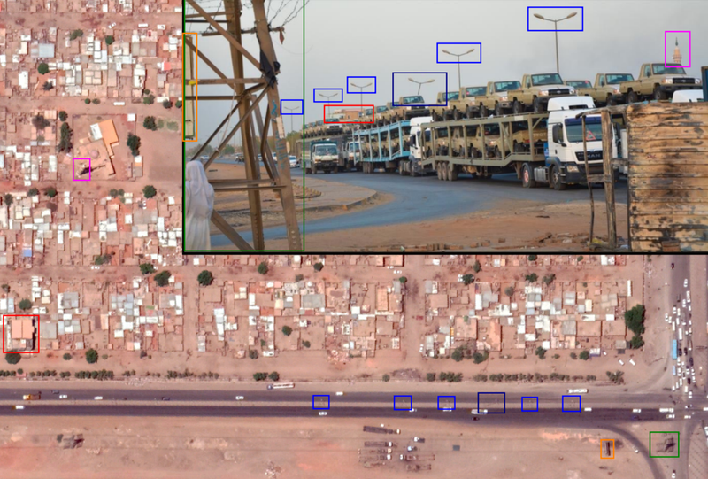 Source: Inset: Image of vehicle transporter circulating on Sudanese social media. Main picture: Google Earth satellite imagery, with coloured boxes geolocating the minaret, lamp posts, and pylons shown in the photo