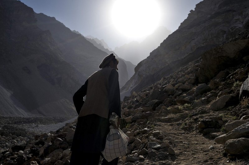 Man climbing a mountain to reach the mine