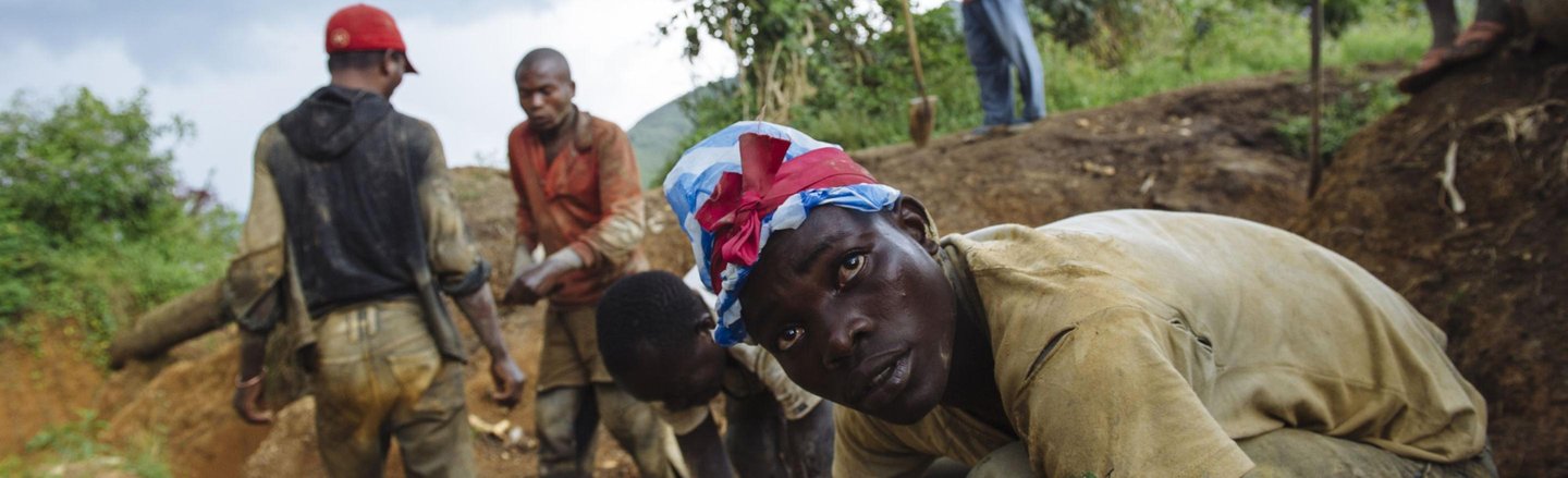 artisanal miners pan for gold in mine in drc, africa