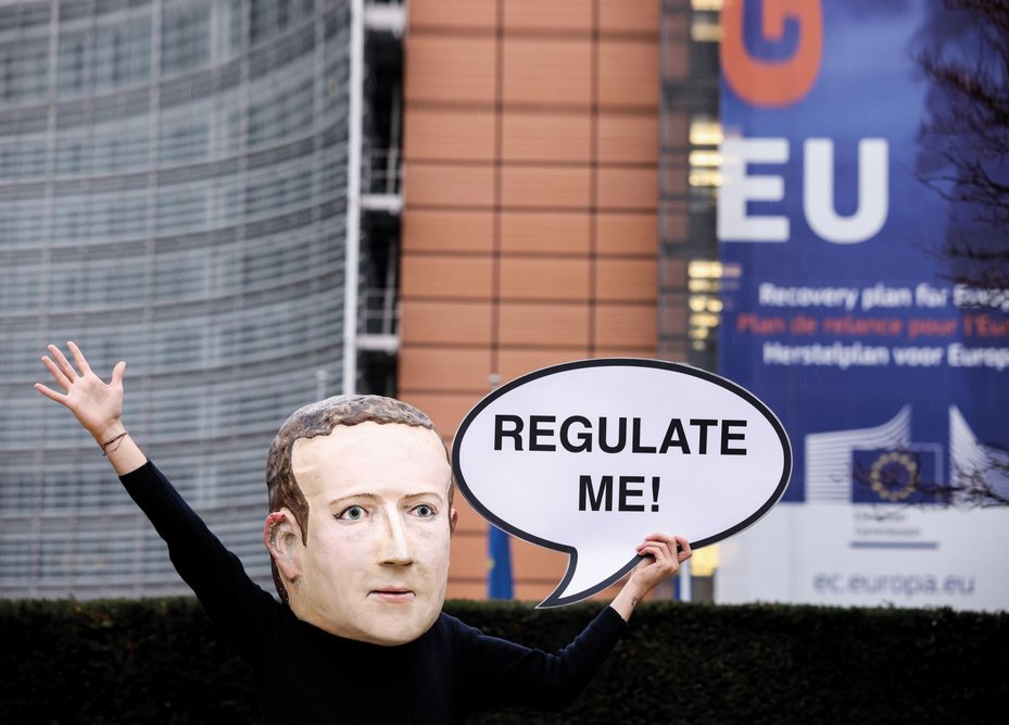 protestor dressed as mark zuckerberg calling for big tech regulation