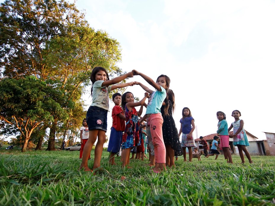 Children play in front of the school at Campo Agua’e, Paraguay