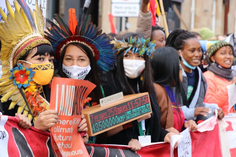 Land and environmental defenders attend a climate strike march organised by Fridays for Future Scotland during COP26 on 5 November 2021, in Glasgow, Scotland. Jasmin Qureshi / Global Witness