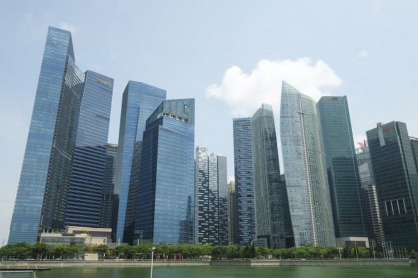 DBS and Standard Chartered (offices of both pictured here in Singapore)