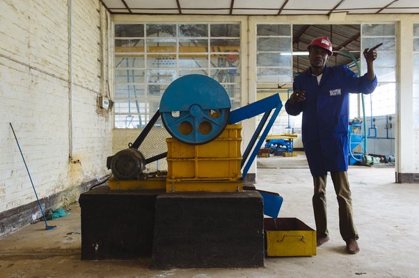 An engineer is pictured next to a machine at the "Centre de retraitement des minerais" (CRM)--the Mineral Reprocessing Centre--in Bukavu, South Kivu province, in the east of the Democratic Republic of the Congo