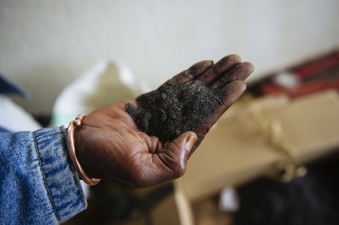 An engineer handles rejected mineral ore in the "Centre de retraitement des minerais" (CRM)--the Mineral Reprocessing Centre--in Bukavu, South Kivu province, in the east of the Democratic Republic of the Congo