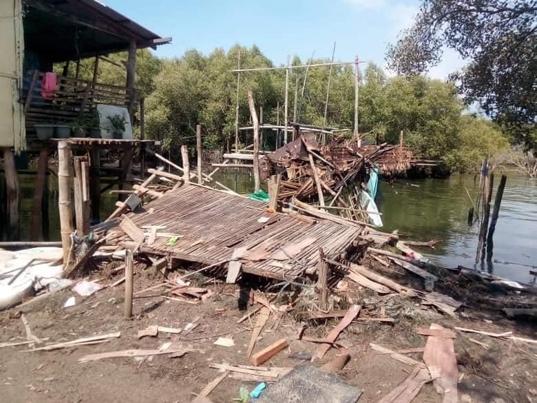 Community members in Taliptip demolish their own homes in exchange for financial compensation from San Miguel.