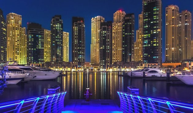 buildings lit up at night in Dubai Marina, United Arab Emirates