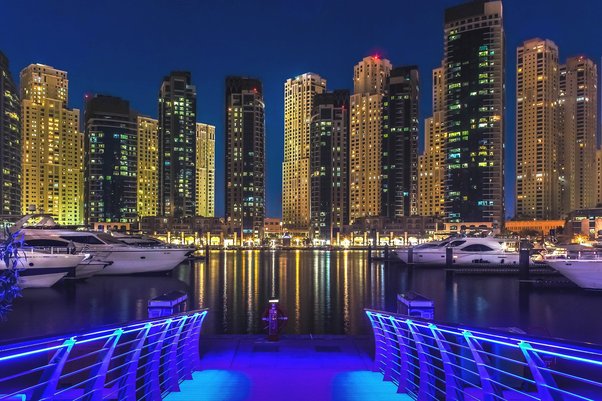 buildings lit up at night in Dubai Marina, United Arab Emirates