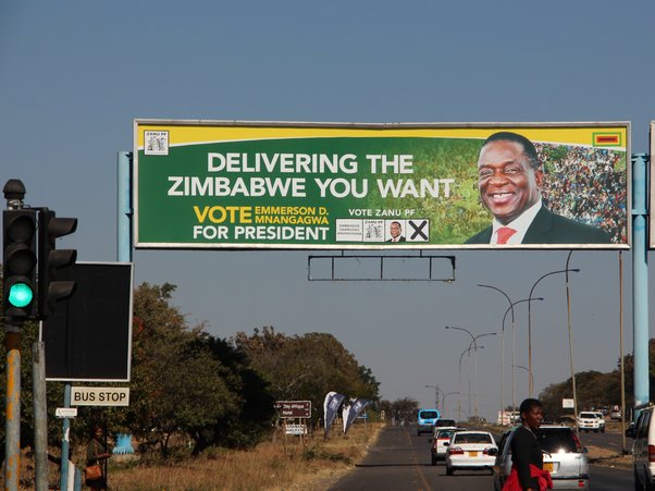 A billboard saying 'delivering the Zimbabwe you want' 'Vote Emmerson D Mnangagwa for president'