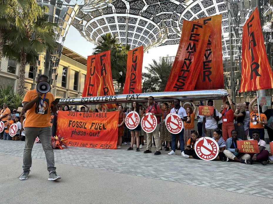 protestors call for fossil fuels phase-out at protest at cop28 in Dubai