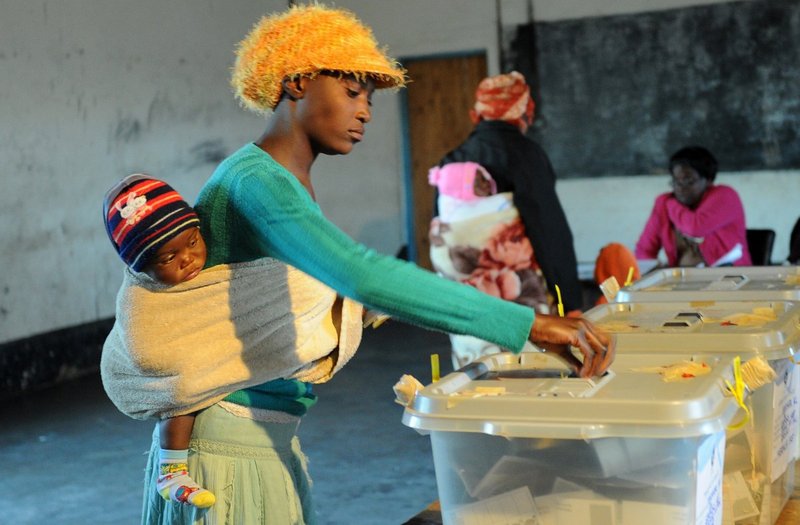 Voters in the 2013 Zimbabwe election. ALEXANDER JOE/AFP via Getty Images