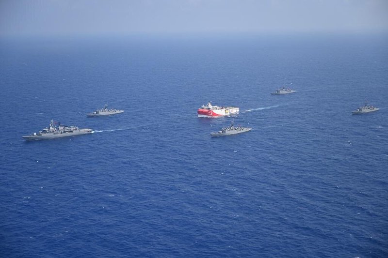 Turkish warships escort a survey ship