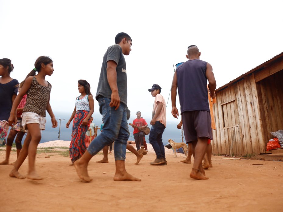 Members of the Hugua Po’i community in Paraguay perform a dance