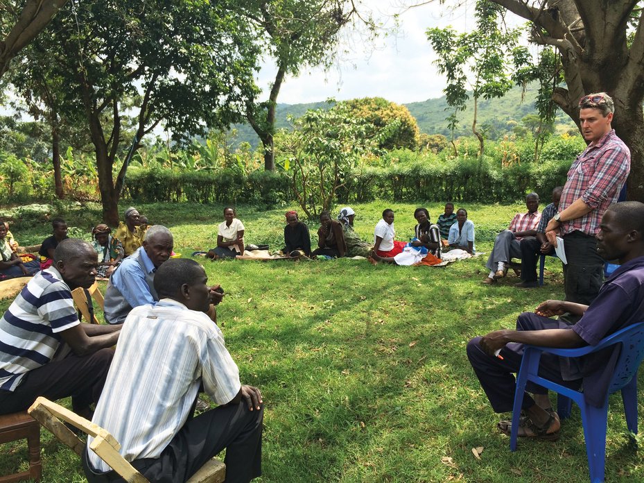 Global Witness campaigner meets with villagers in Eastern Uganda