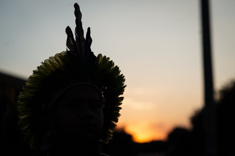 indigenous peoples' representative's silhouette in setting sun