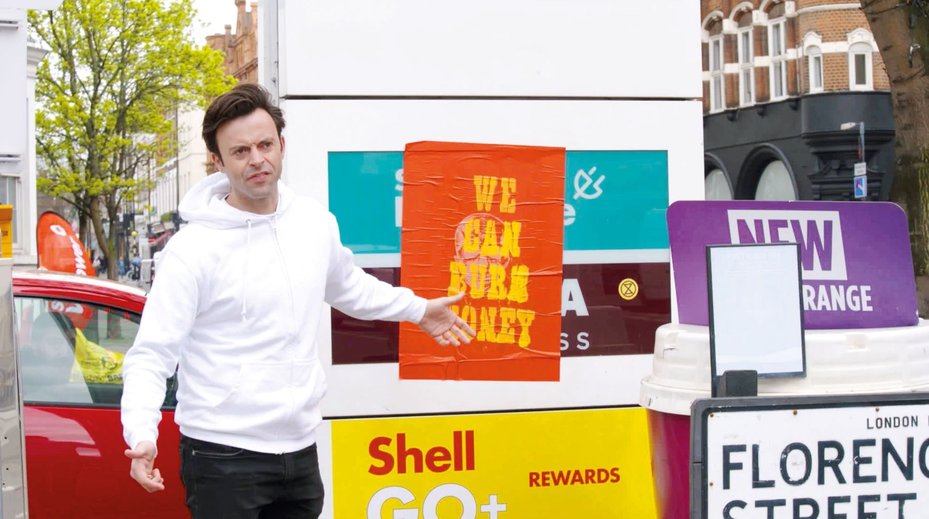 still from Jolyon Rubenstein (comedian and presenter) video to raise awareness of Shell's tax practices, specifically their minimal tax contributions in the UK