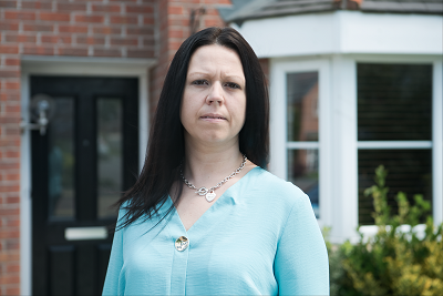 photo of leaseholder outside her house