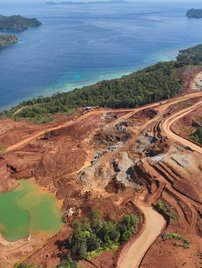 Image from above showing nickel mining site with destroyed rainforest on tropical island of Kawe in Raja Ampat, West Papua, Indonesia
