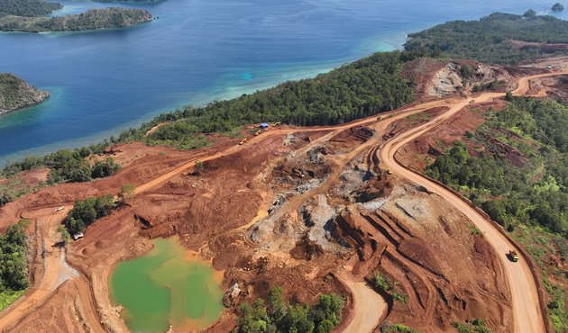 Image from above showing nickel mining site with destroyed rainforest on tropical island of Kawe in Raja Ampat, West Papua, Indonesia