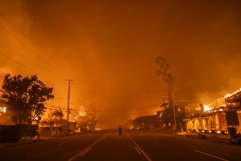 The push to keep burning fossil fuels means Americans must now regularly reckon with dramatic climate events, like 2025's Los Angeles wildfires. Apu Gomes / Getty