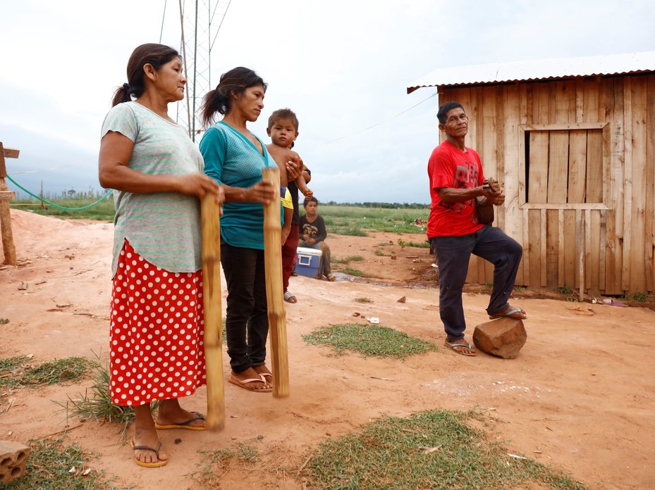 Mbya Guaraní indigenous elders make music for a ceremonial dance at Hugua Po’i