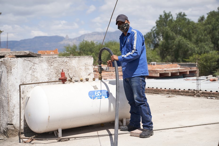 A Gas Villa de Reyes worker delivers gas to a restaurant in Villa de Reyes, Mexico