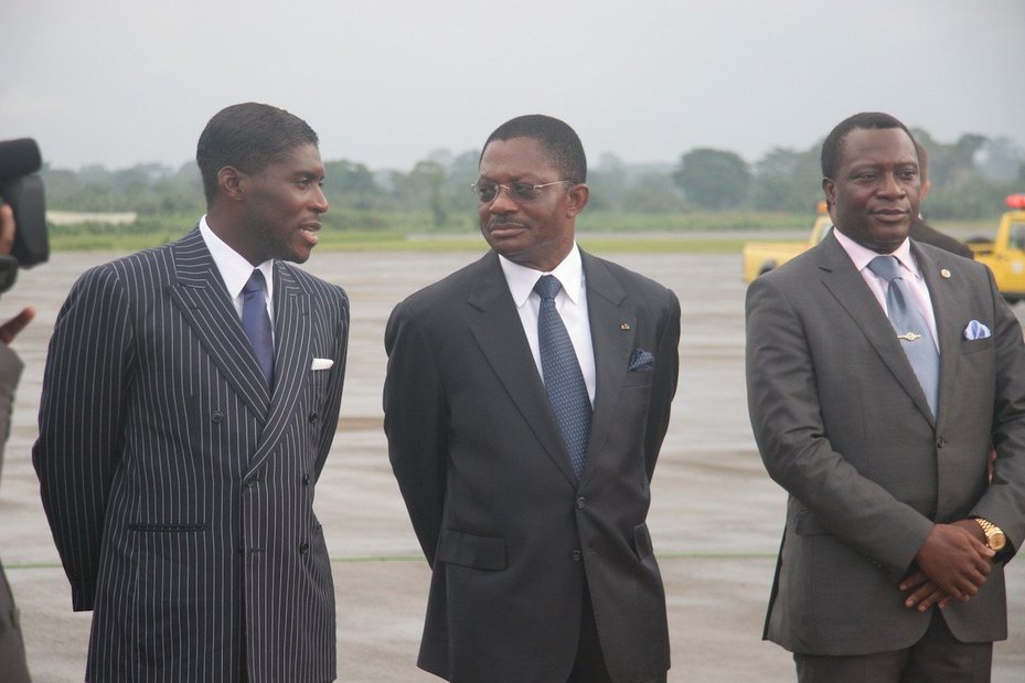 President Obiang of Equatorial Guinea stands with two other men