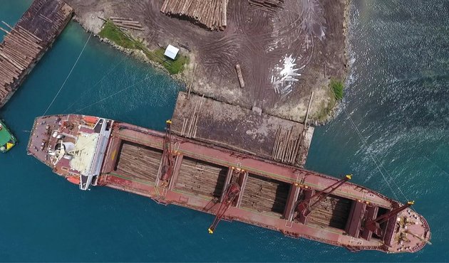 aerial shot of cargo boat in papua new guinea