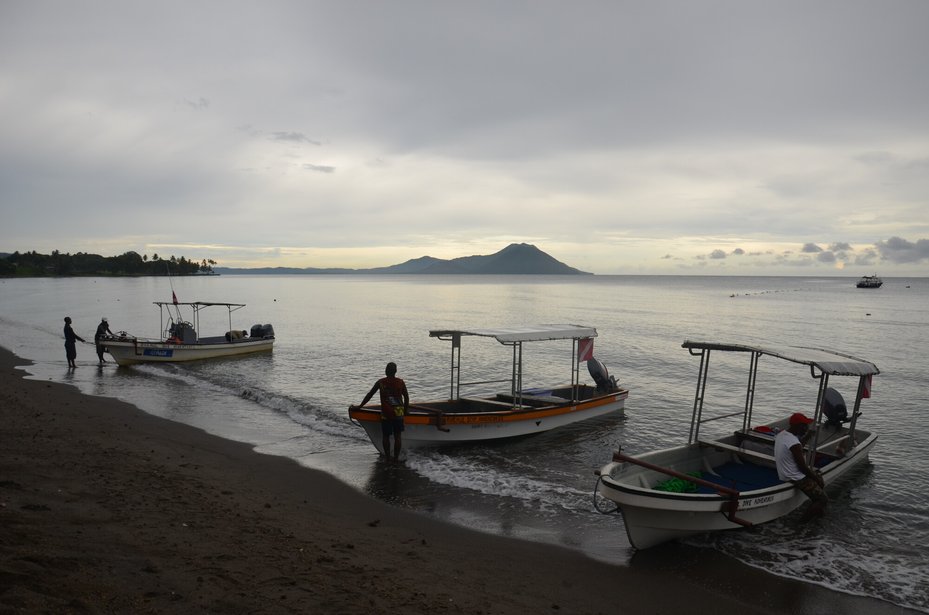 Passenger boats for hire wait at Rabaul harbor, East New Britain Province, Papua New Guinea