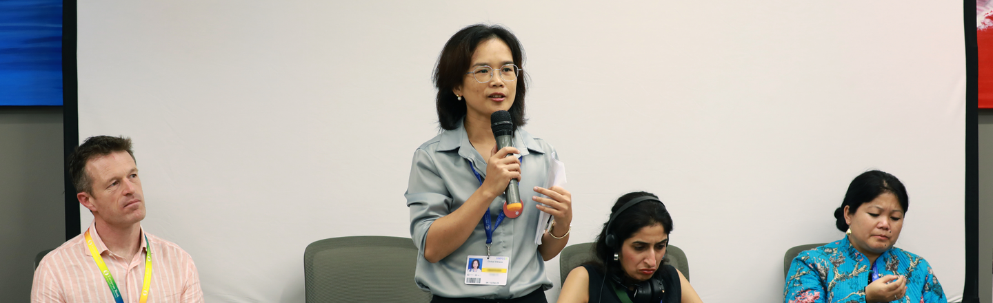 Global Witness staff speak at a 'listening session' event during COP28.