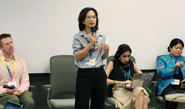 Global Witness staff speak at a 'listening session' event during COP28.