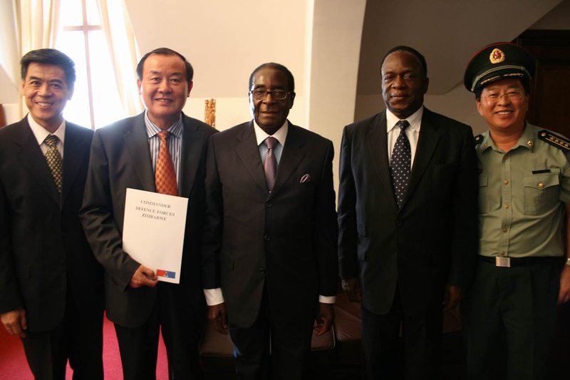 Zimbabwe's President Robert Mugabe and Minister of Defence Hon. Emmerson Mnangagawa at the granting of a diamond mining licence.