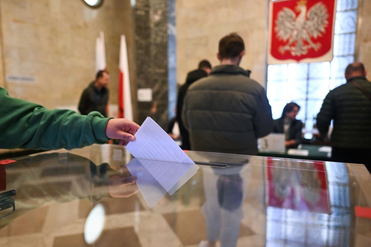 A man casts his ballot during the first round of the presidential elections on May 18, 2025 in Warsaw, Poland