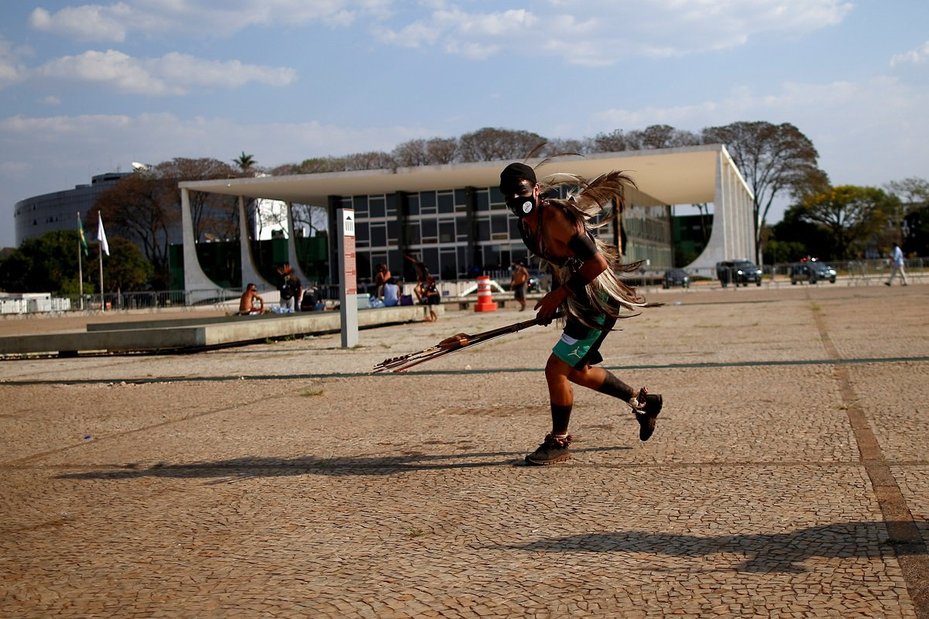 An Indigenous person takes part in a protest on the day of Brazil's Supreme Court trial of a landmark case on Indigenous land rights in Brasilia, 15 September 2021