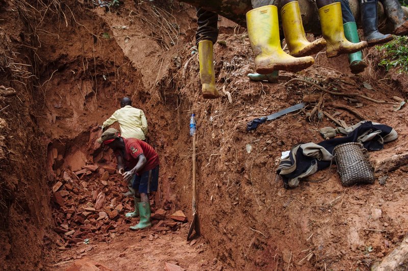 Artisanal miners dig a tunnel for a new cassiterite mine on the Kyabumbwa hill, near to the village of Kakulu, in South Kivu in the east of the Democratic Republic of the Congo, 2015