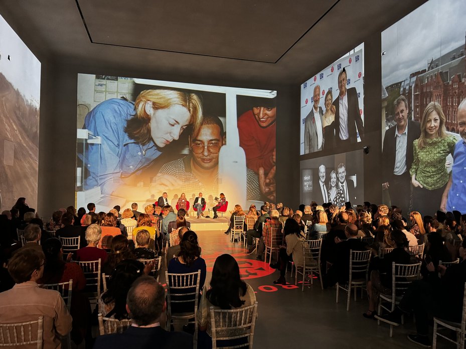 People listening to a panel discussion at an event held by Global Witness