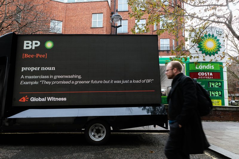 Global Witness billboard reads - 'BP: a masterclass in greenwashing. Example: 