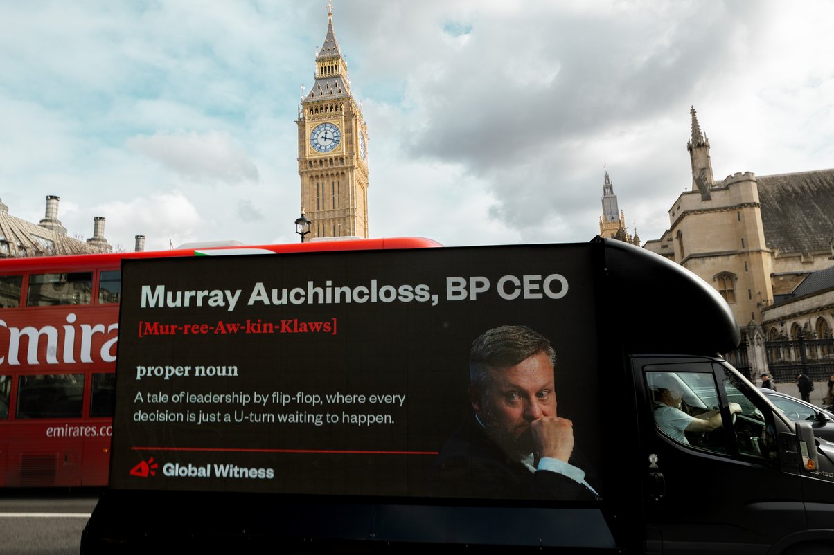 stunt van showing billboard of bp ceo flip flopping on climate commitments