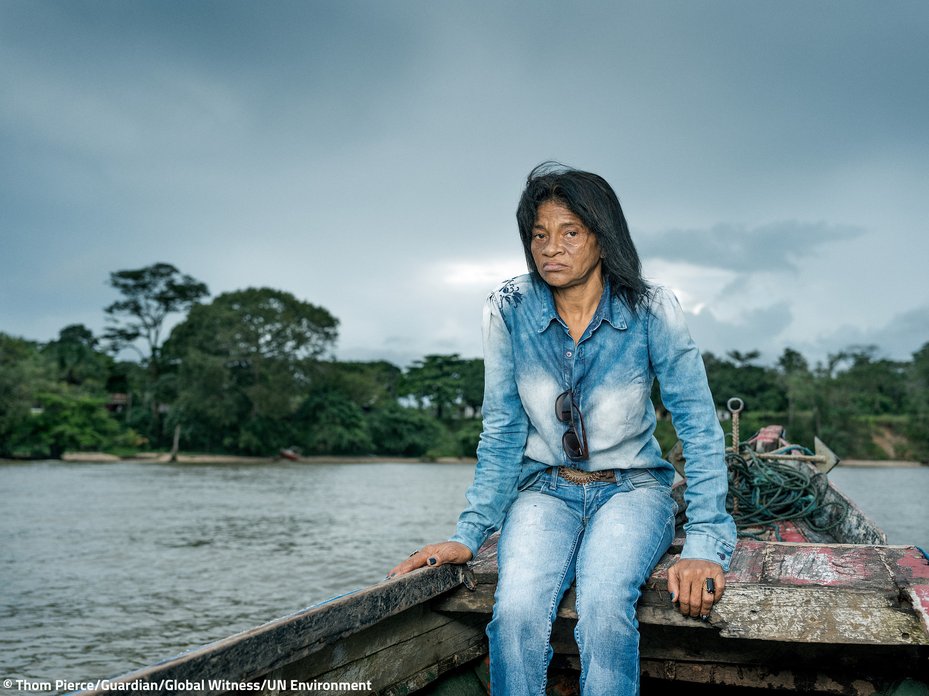 Environmental activist sitting in a field