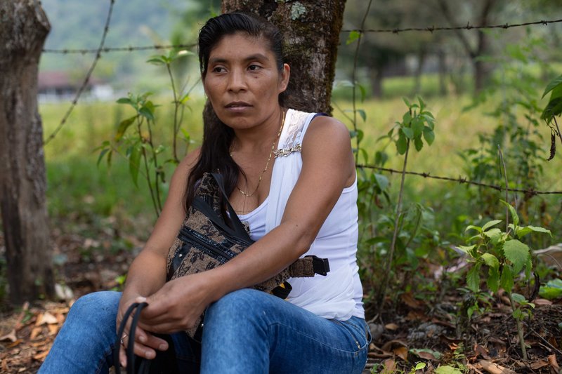 Ercilia Perez Lopez, 38, from Bella Linda and member of the Ixquisis Peaceful Resistance against the San Mateo Hydroelectric Project, rests under a tree.