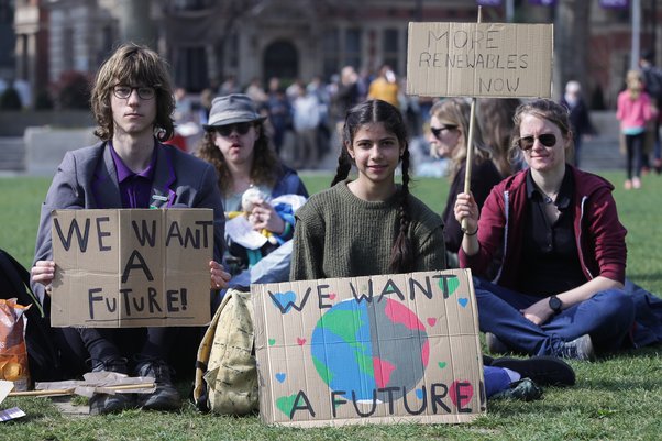 Activists holding a "We want a future" banner at a protest march