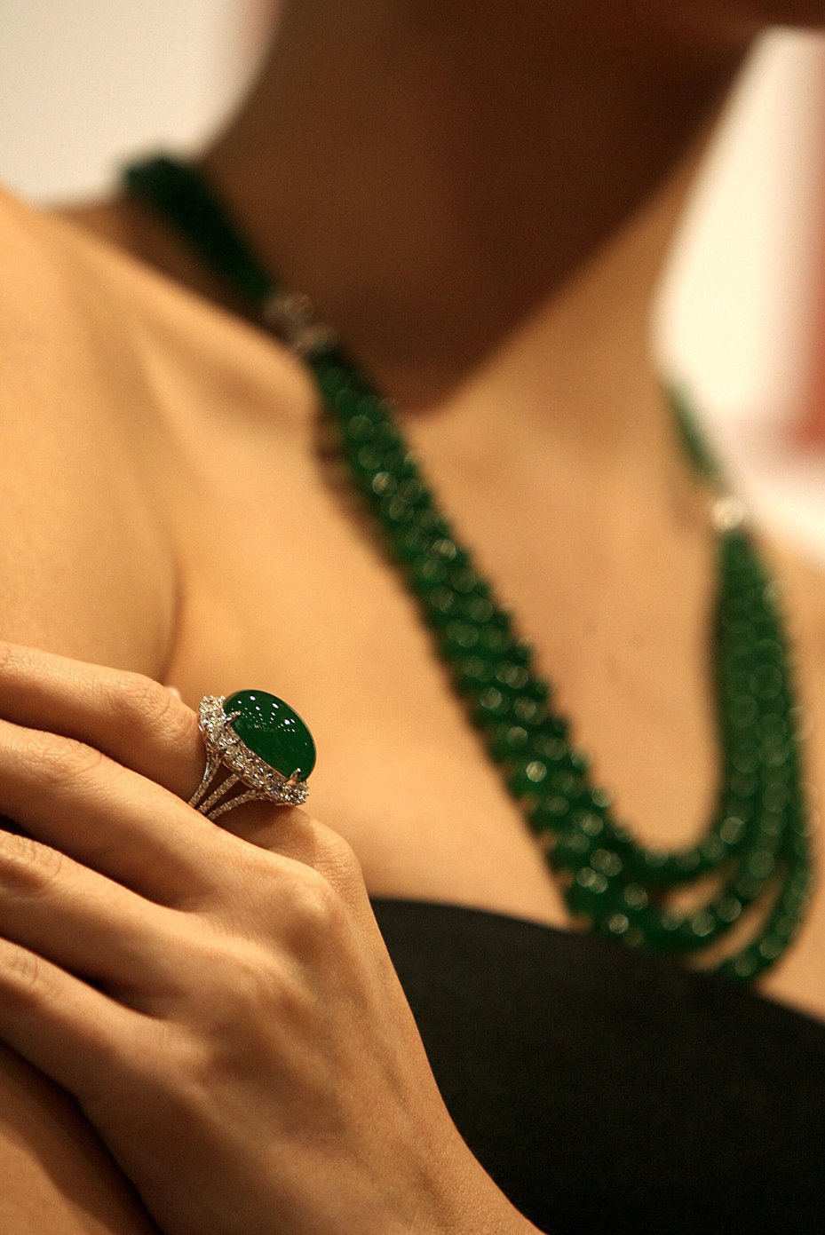 Jadeite cabochon & diamond ring, and a jadeite bead necklace