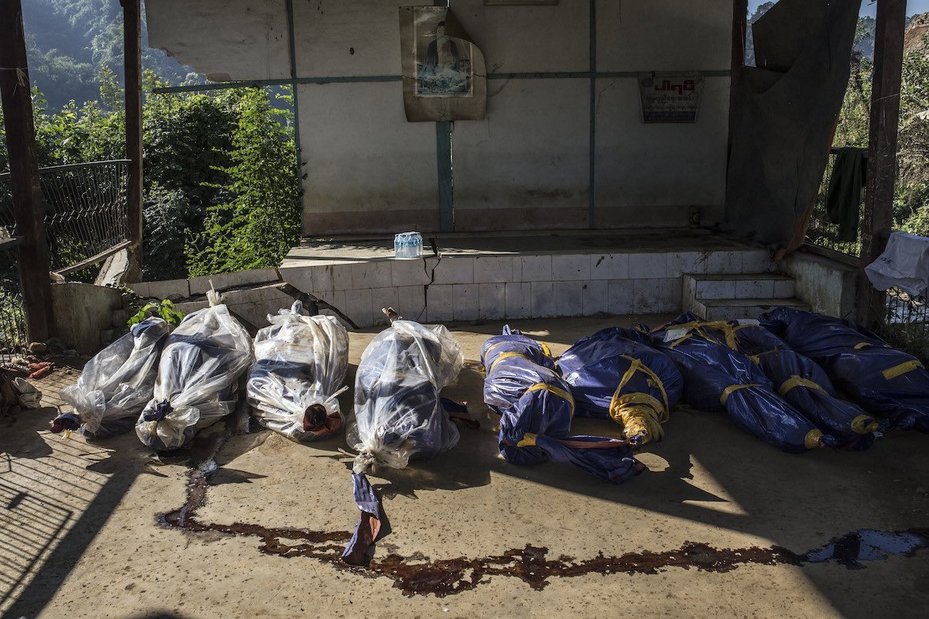 Bodies retrieved from a landslide in November 2015 which killed over 100 people lie inside the compound of Hpakant general hospital.