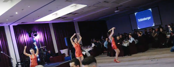 screenshot from a YouTube video of SLB’s Russian holiday party