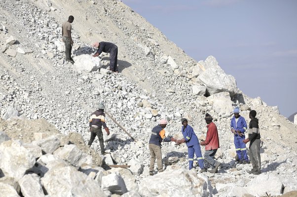 Workers pick lithium at Sandawana Mines in Mberengwa, Zimbabwe