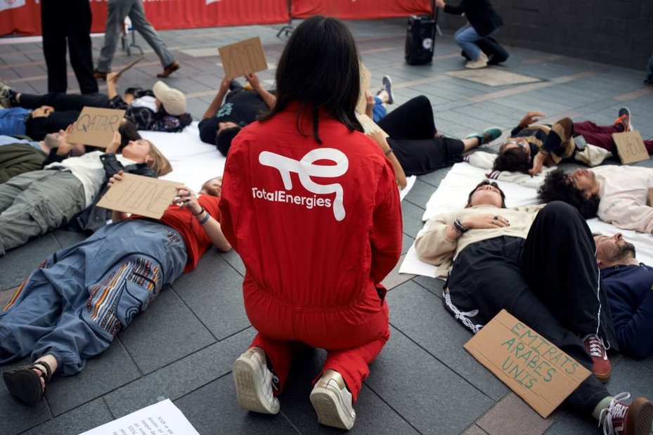 Activists from the coalition "StopTotal" staging a die-in in Toulouse, France