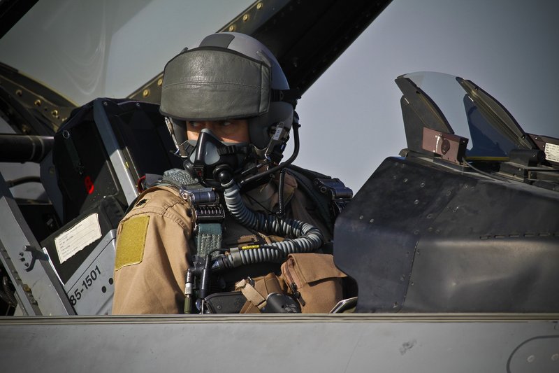 U.S. Air Force Lt. Col. Aaron Lade, an F-16C+ Fighting Falcon pilot, prepares for take off Jan 17, 2012 at Bagram Air Field, Afghanistan. Lade is the commander of the 455th Expeditionary Operations Support Squadron.