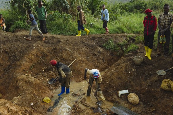 Artisanal miners pan for gold at the Mufa II gold mining site in South Kivu