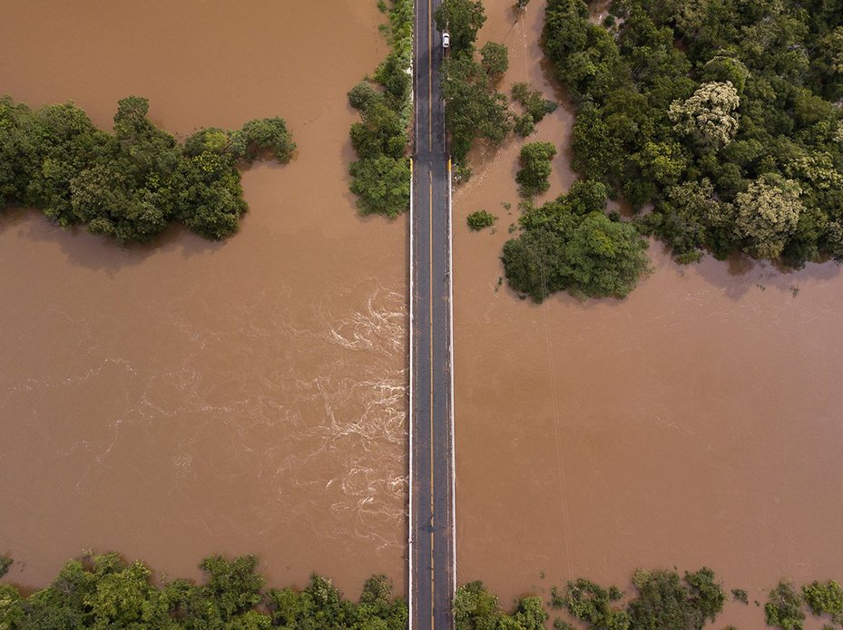 View of a bridge almost consumed by flood water on the border of the municipalities of Diamantina and Olhos DAgua in Minas Gerais state, Brazil