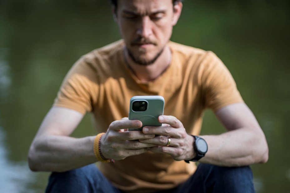portrait of romanian defender, vlad, using phone